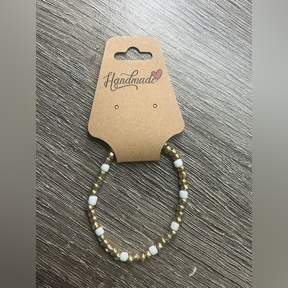 Women’s gold and white bracelet